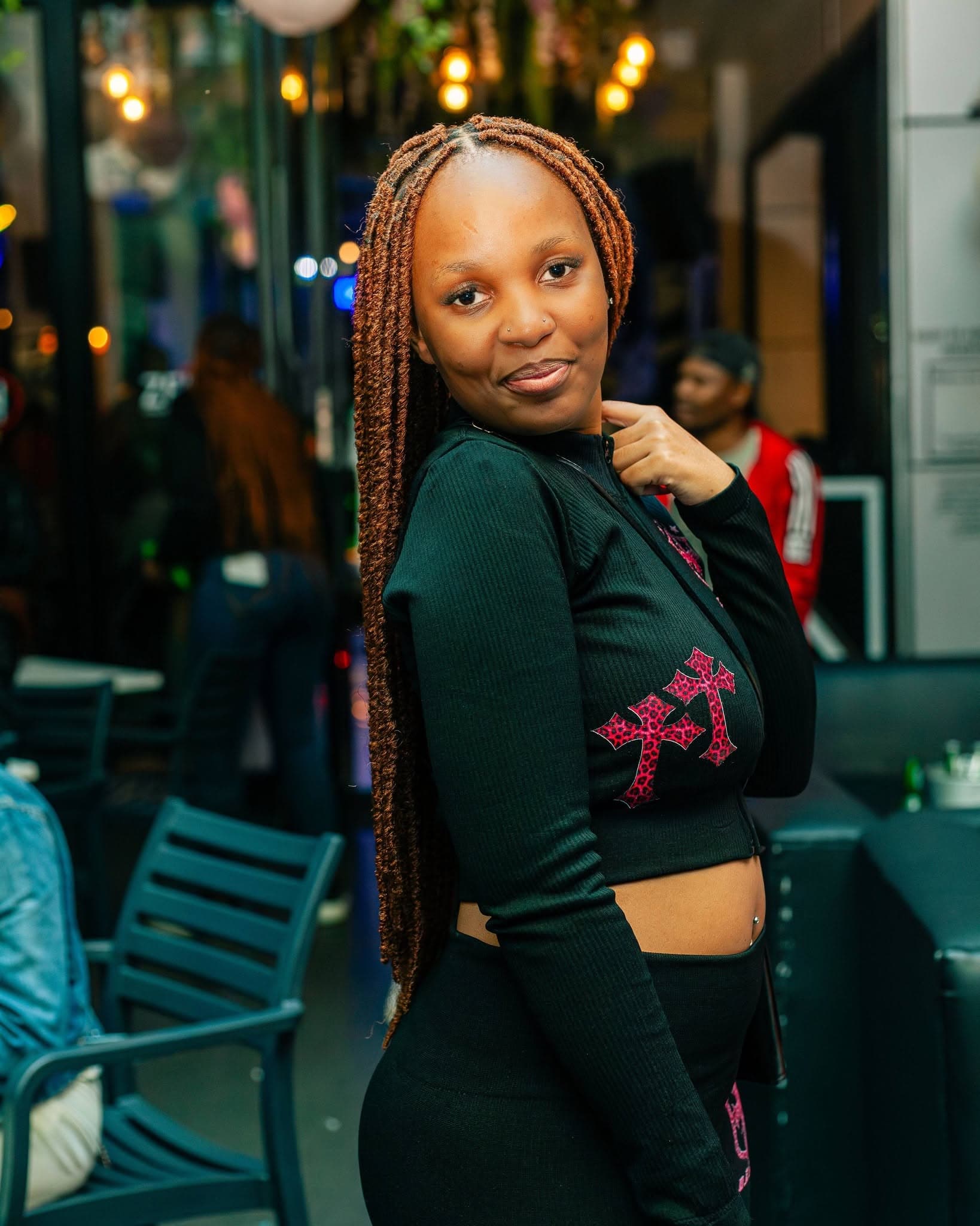 A guest poses in the lounge seating area during an evening gathering.